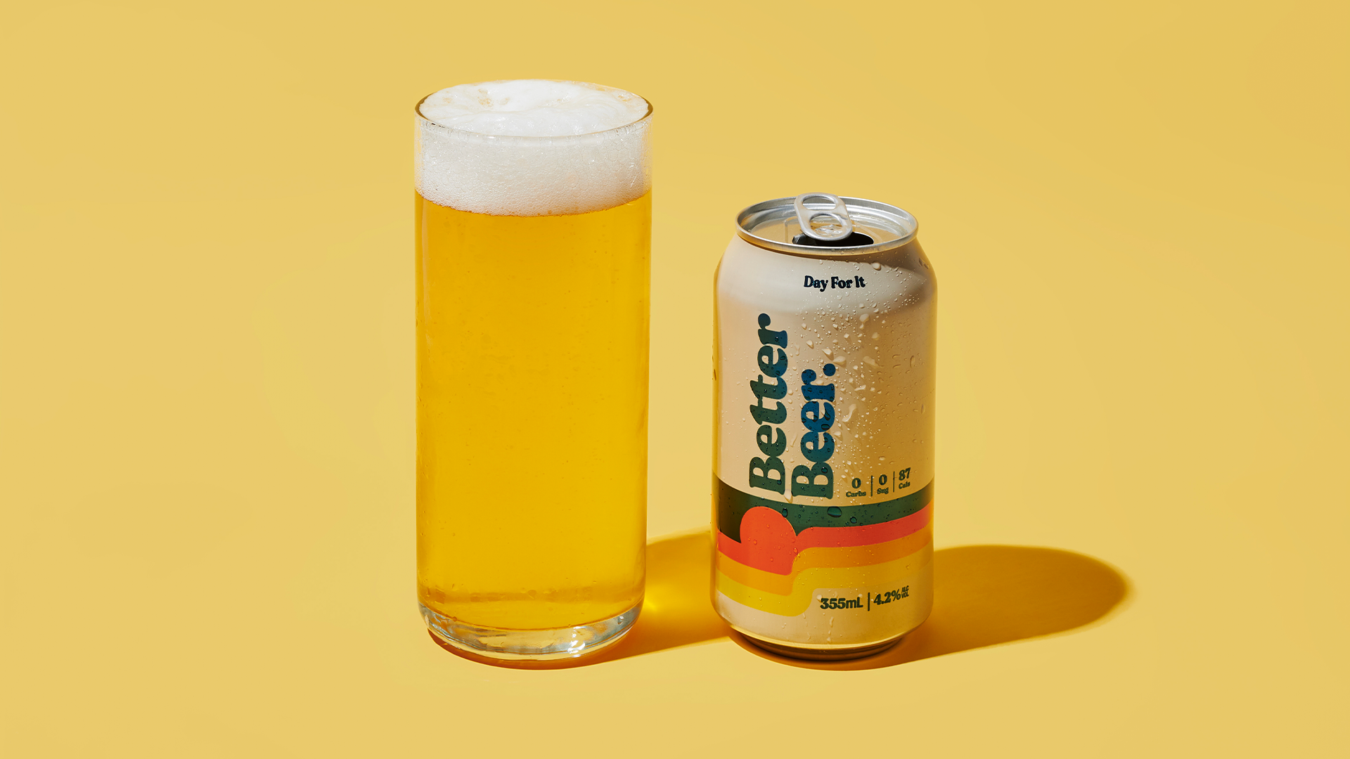Better Beer can and glass on yellow background